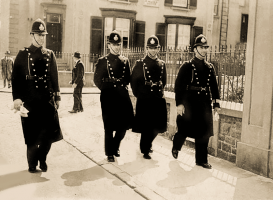 Policemen walking along Oxford Road, possibly on their way to Muratti duty at Springfield