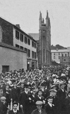 A band leads garrison troops away from the church after Sunday morning service
