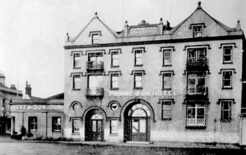 The Weighbridge frontage has now been developed into a more symmetrical shape and the archway which previously opened into the courtyard and garden behind has now been enclosed. Huquet and Sons' coal merchants still occupy the Conway Street corner site