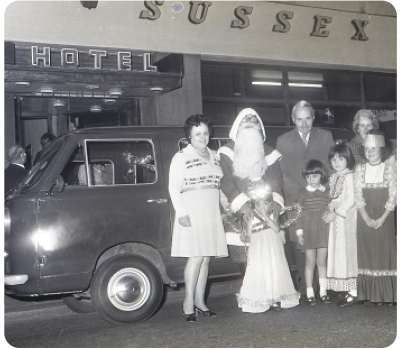 A charity minibus handover outside the Sussex Hotel in the 1960s, when it had been a hotel for over a century and was one of the oldest small, family-run hotels in the centre of St Helier