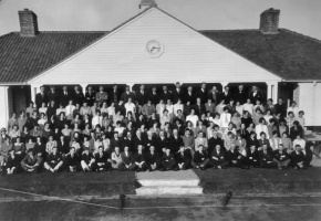 A staff photograph indicates the size of the workforce at its peak