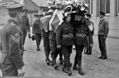 The funeral of Drummer William Wright who died on 7 March 1916 while serving in Jersey with the 4th Battalion South Staffordshire Regiment. The 46-year-old, who was married and from Birmingham, was being borne by comrades from Brighton Road Military Hospital to Almorah Cemetery for burial.