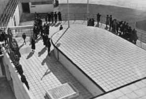 Official guests on an opening day tour leave the observation platform for the forecourt