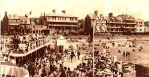 A crowded pool and beach in the 1930s