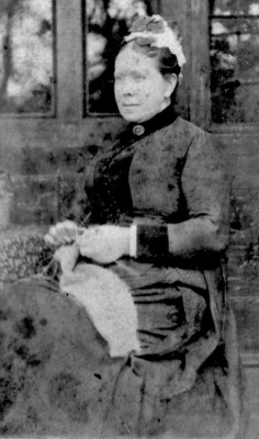 Woman knitting by R Eager