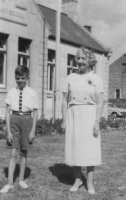 Florence Mary Hacquoil, born in St Brelade in 1902, teacher of the senior class at First Tower School for many years, with Jerripedia editor Mike Bisson in front of the school in 1958