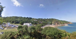 Greve de Lecq today. This Google Street View shows the remains of the pier on the right, with the line of rubble stretching along its original length