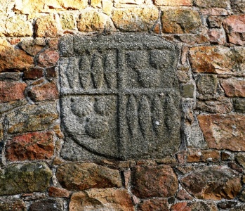The arms of de Carteret, quartering Le Febvre/Dumaresq, on the colombier