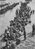 Prisoners of war on the beach awaiting their departure from the island