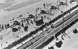Six of seven planes lined up on the beach at West Park ready to depart, showing just how busy Jersey's seaside 'airport' became in the mid-1930s. Jersey Airways had eight planes in their fleet at the time, so presumably this photograph was taken from the eighth. The coach which served as a waiting room for departing passengers was caught by the rising tidy soon afterwards and damaged beyond repair