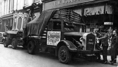 Fairground equipment parked outside Woolworth in King Street