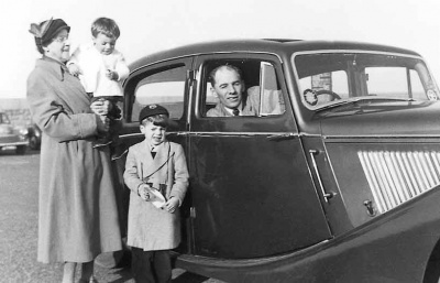 Roy Bisson with his sons Mike and John and a family friend