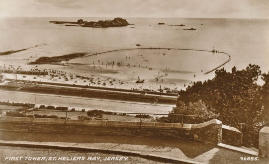 You can't believe everything printed on a postcard. This is a fine view of the Victoria Marine Lake at West Park, wrongly captioned First Tower. And it is in St Aubin's Bay, not St Helier's Bay