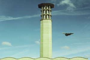 A Vulcan flies past La Collette power station chimney