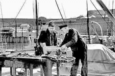 TB Davis working on Westward in St Helier Harbour in 1936