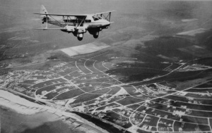 A Jersey Airways biplane crossing the South Coast of England in the 1930s