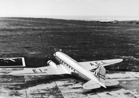 An Aer Lingus Dakota at Jersey Airport in 1946, parked on grass