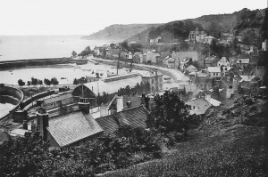 This photograph shows work under way in extending the line past St Aubin towards Corbiere. The loop around the terminus is complete and a train is standing there, but the line and level crossing gates in front of the terminus have yet to be completed