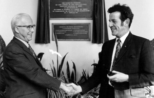 Frank Guenier hands over as Director of Postal Administration to Mike Orbell