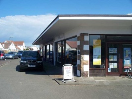 The parade of shops at Red Houses, St Brelade used for the offices of 'Hobson and Young' estate agents, the workplace of Jim's girlfriend Susan Young
