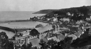 This picture was taken some time after. The triangle has been filled in and trees planted on the mound of soil created. Buildings have also been constructed on the reclaimed land and trees have been planted on the roadside of the terminus