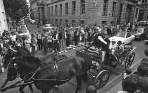 A wedding carriage leaves the church and heads for Library Place