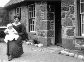 Woman and baby at La Corbiere (probably the Bivouac Tearoom)