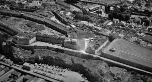 An aerial view of Fort Regent in the 1950s shows Pier Road with a ground-level car park before the multi-storey was built