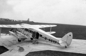 DH86 Dragon G-AGYF on the apron in July 1937, with St Peter's Barracks in the background