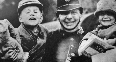 A friendly policemen looks after young evacuees