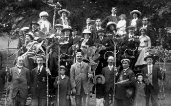 Charabanc passengers with Jersey cabbage sticks