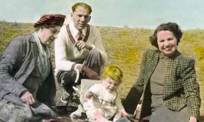 A hand-coloured photograph of Constance Smith, Roy, Peggie and Mike Bisson in 1950