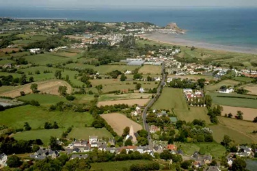 The parish of Grouville from the church in the foreground to Gorey, below Mont Orgueil Castle in 2006