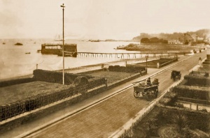 A solitary car passes along a quiet road