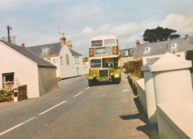 A JMT double-decker passes the Seymour Inn at Grouville