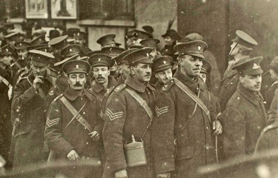 Contingent members, mostly likely on the New North Quay, awaiting their turn to board ship ready for departure from the Island on 2 March 1915.
