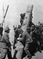 Installing anti-tank poles on the beach