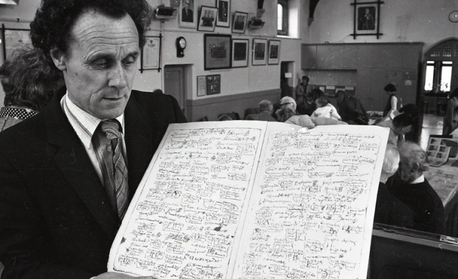 Family historian Alfie Pipon with a 17th century St Lawrence register in 1983