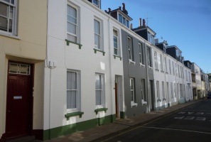 ... an interesting juxtaposition of two- and three-storey one one side, contrasting with an unbroken, homogenous row opposite ...