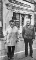 Vera and Len Hansford in front of their shop