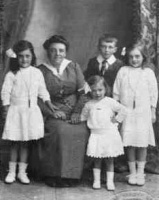 Mary Adelina Renouf (1881-1947), daughter of Alfred Charles (1863-1946) and Marie Augustine, nee Beuzeval (1865-1951) married Philip George Cauchard (1881-1972) at St Luke's Church, Jersey, in 1907. She is pictured here with their children