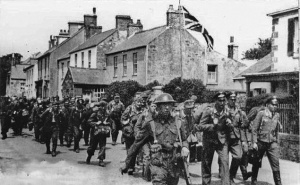 British soldiers escort German prisoners through St Lawrence