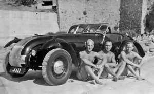 An Allard K1 on the beach in St Brelade's Bay with its owner, Bob Le Breton, and friends. Mr Le Breton was given the car by his uncle in 1948. The number plate, J111, no longer attached to the car, sold at auction in March 2018 for £54,000