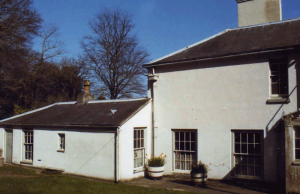 The Back Yard: scullery and and outer scullery (both demolished by a later owner to make way for a new main entrance, with lamps and eagles)