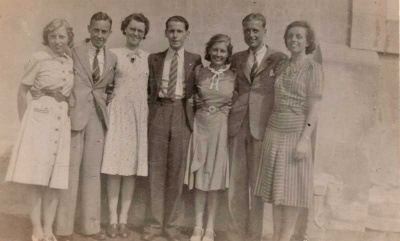Roy Skingle (centre) with friends at Laufen internment camp. The ladies are thought to be nurses