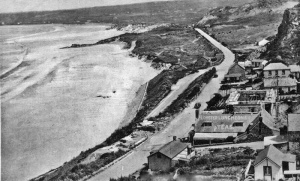 Lobster luncheons advertised on the roof in the foreground and the hotel is being constructed behind