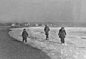 Strolling along the frozen water's edge at La Haule in 1963