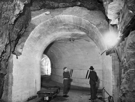 The Germans accumulated nearly 30,000 tons of ammunition, ranging from 7.65mm pistol bullets to 22cm shells, for their largest coast guns. The bulk of this was stored in three underground tunnels cut into hillsides at valley level. The remainder was in gun bunkers and billets.