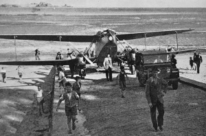 A Rapide is removed from the beach at La Haule after an emergency landing in 1951
