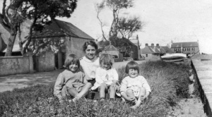 Doris Kempster and her three youngest sisters across the road from their La Rocque home